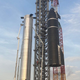 Starship SN20 as it’s being lifted to the top of the Super Heavy booster.